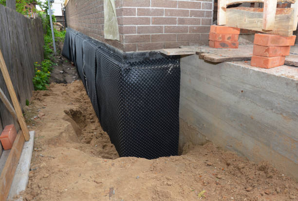 Happy homeowners after waterproofing job in Harleysville